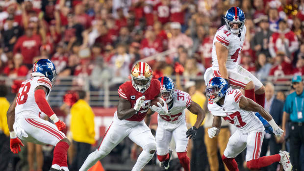 September 21, 2023; Santa Clara, California, USA; San Francisco 49ers wide receiver Deebo Samuel (19) runs the football against New York Giants linebacker Bobby Okereke (58), cornerback Tre Hawkins III (37), linebacker Micah McFadden (41), and safety Jason Pinnock (27) during the third quarter at Levi's Stadium. Mandatory Credit: Kyle Terada-USA TODAY Sports